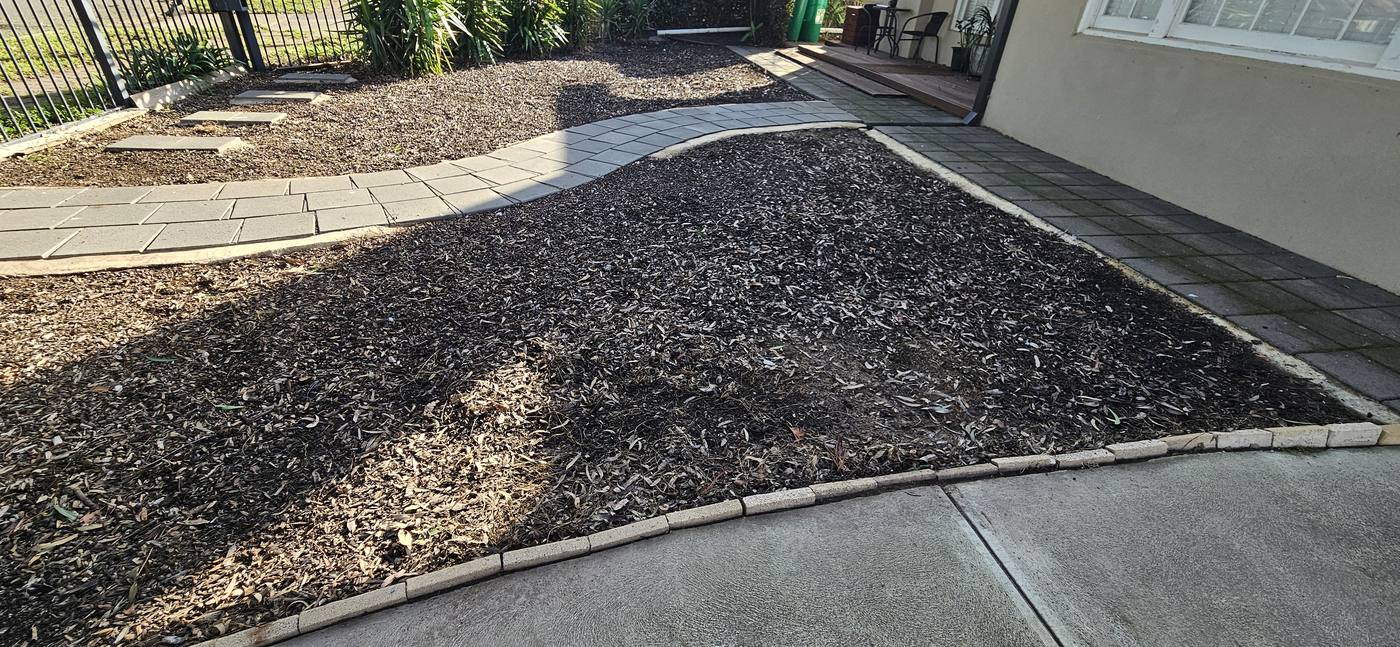 After: front yard cleaned up with fresh mulch and tidy beds